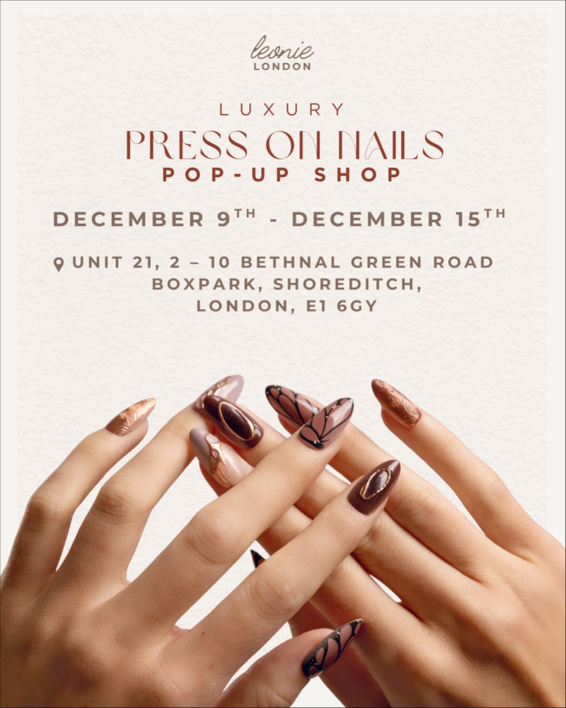Advertisement for Jkavw Nail luxury press-on nails pop-up shop with hands showing nail designs.